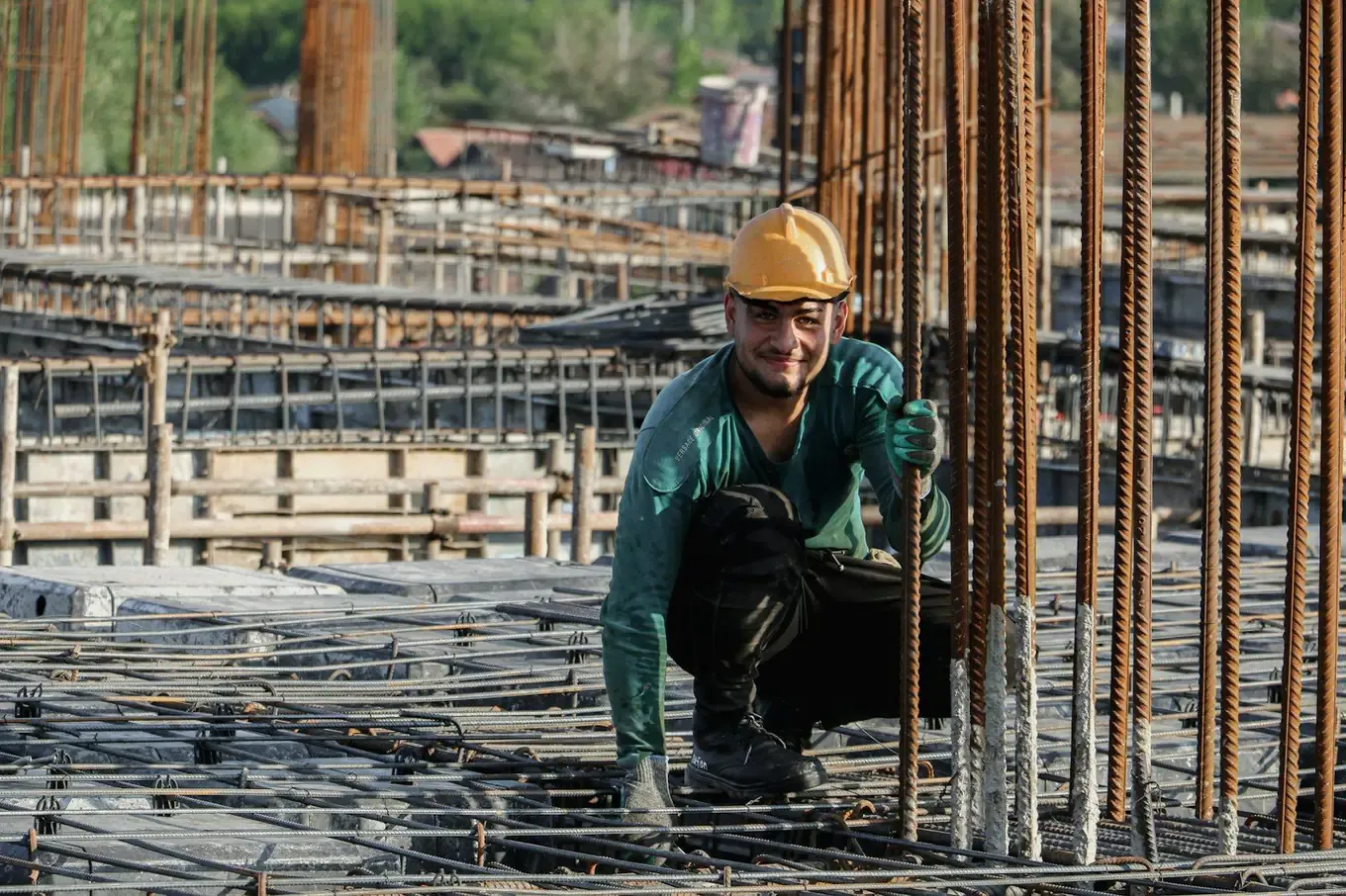Construction worker in a hard hat on a rebar building site
